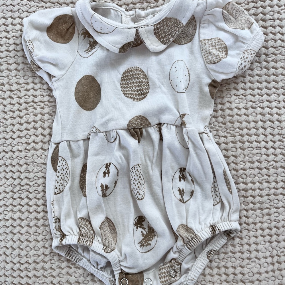 Kate Quinn Peter Pan bubble onesie outfit with neutral Easter spring eggs